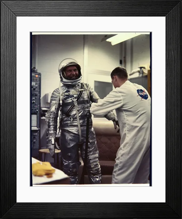 Framed Print : Man Assisting Walter Schirra into Spacesuit