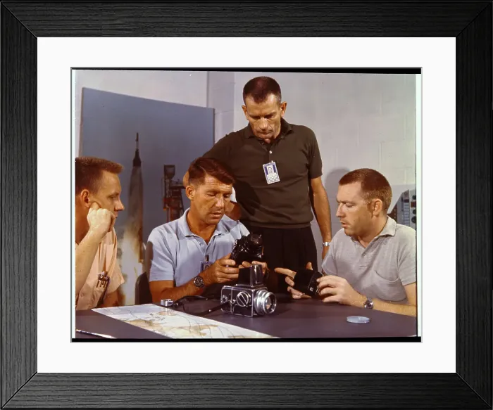 Framed Print : Walter Schirra Inspecting Camera Equipment
