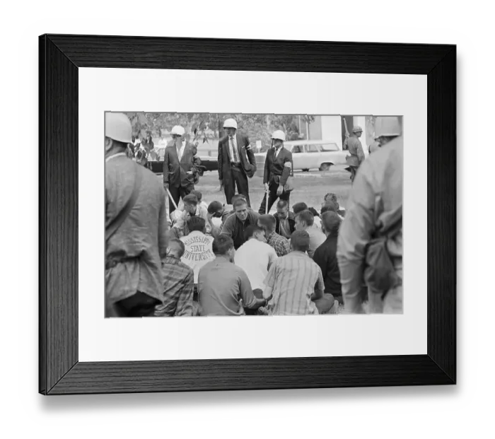 Framed Print : College Students Sitting in a Huddle While Being Watched by Federal Police Framed Print : College Students Sitting in a Huddle While Being Watched by Federal Police