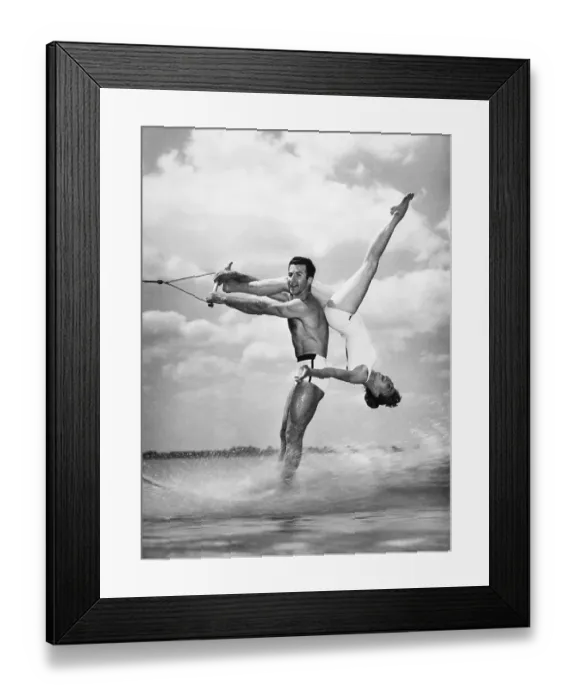 Framed Print : Water-Skiing Pair Performing Stunt Framed Print : Water-Skiing Pair Performing Stunt