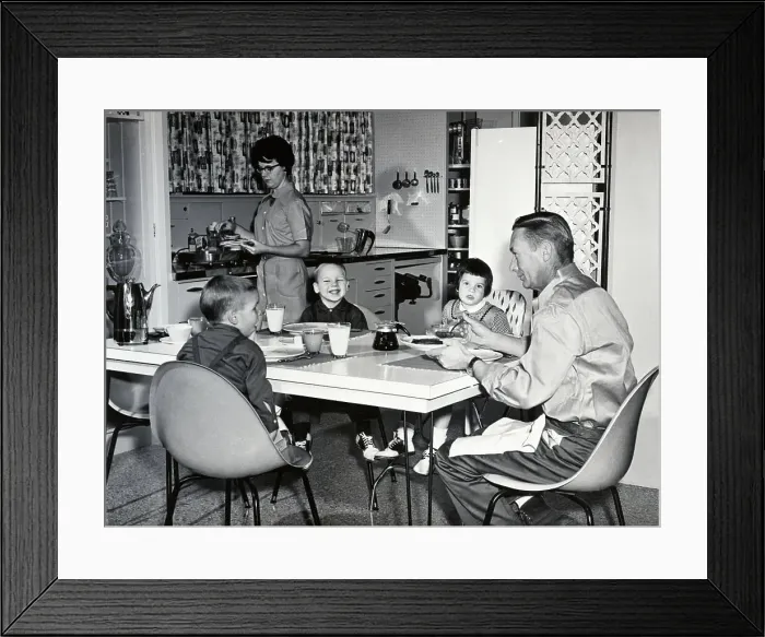Framed Print : Young Family Eating Breakfast in Kitchen Framed Print : Young Family Eating Breakfast in Kitchen