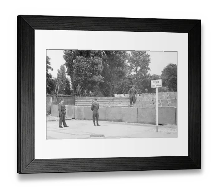 Framed Print : East German Soldier Working on Berlin Wall