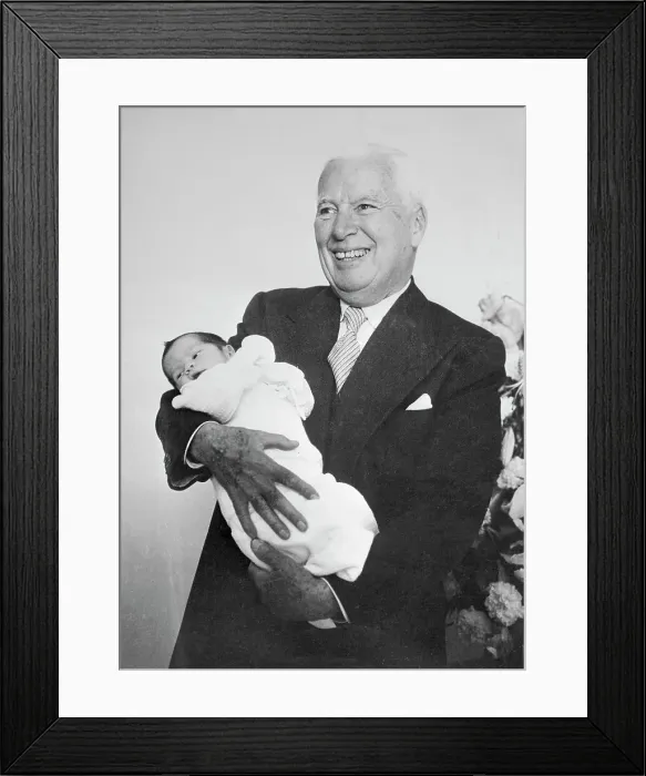 Framed Print : Charlie Chaplin Holding Newborn Son Framed Print : Charlie Chaplin Holding Newborn Son