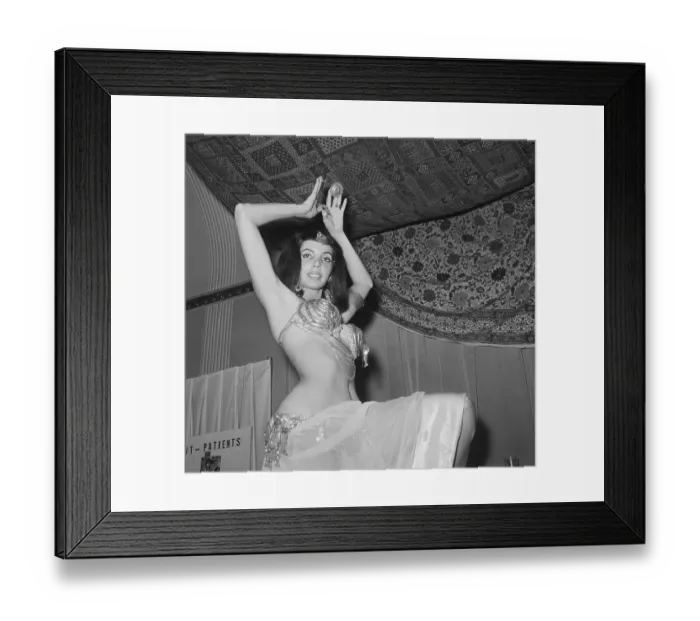 Framed Print : Belly Dancer Posing Underneath Oriental Rug Framed Print : Belly Dancer Posing Underneath Oriental Rug