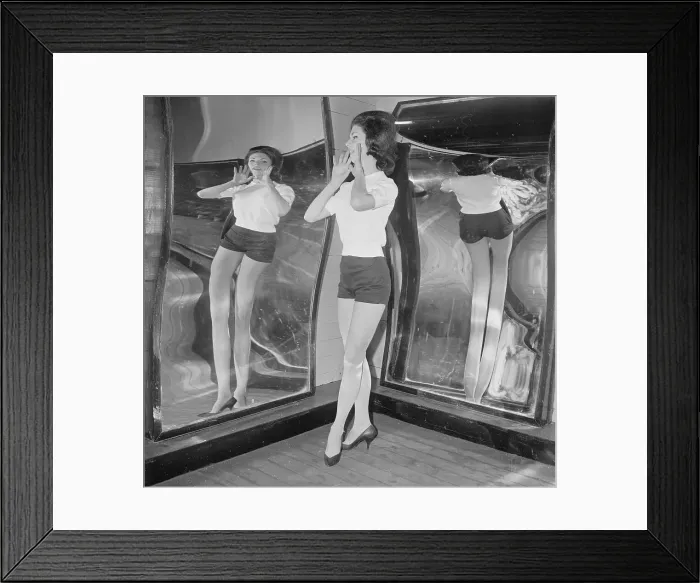 Framed Print : Female Patron Posing in Fun House Mirror Framed Print : Female Patron Posing in Fun House Mirror