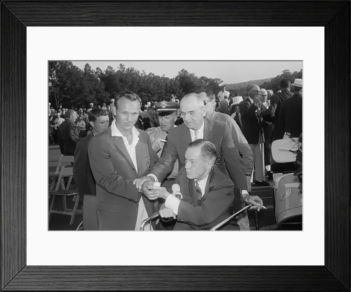 Framed Print : Arnold Palmer Showing a Golf Ball to Bobby Jones Framed Print : Arnold Palmer Showing a Golf Ball to Bobby Jones