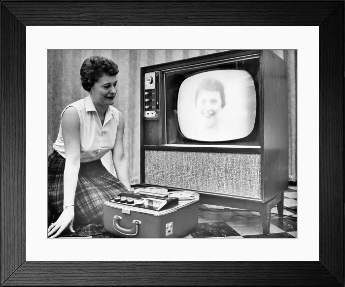 Framed Print : Woman Demonstrates New Video Recording Process Framed Print : Woman Demonstrates New Video Recording Process