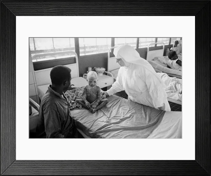 Framed Print : Nun Treating Young Child with Smallpox Framed Print : Nun Treating Young Child with Smallpox