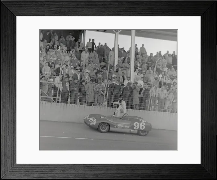 Framed Print : Dan Gurney Climbing into His Race Car Framed Print : Dan Gurney Climbing into His Race Car