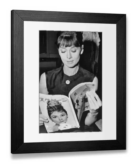 Framed Print : Audrey Hepburn Holding Japanese Magazine with Her Picture Framed Print : Audrey Hepburn Holding Japanese Magazine with Her Picture