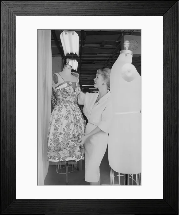 Framed Print : Debbie Reynolds Examining Dress Framed Print : Debbie Reynolds Examining Dress