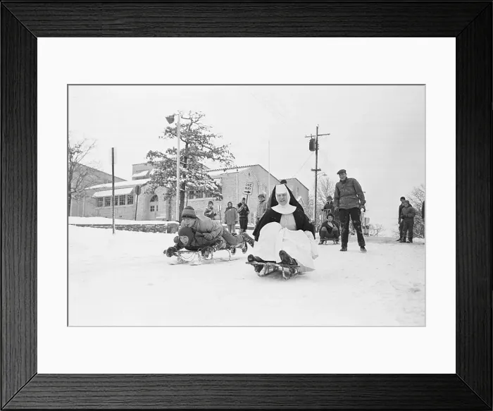 Framed Print : Sister Monica Rides a Sled with Children Framed Print : Sister Monica Rides a Sled with Children