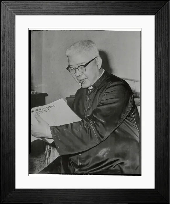 Framed Print : Vietnamese Archbishop Reading with Cigar in Mouth