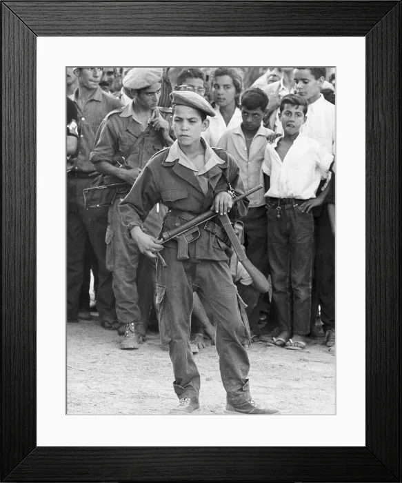 Framed Print : Boy with Gun Stands Alone Before Other Boys Framed Print : Boy with Gun Stands Alone Before Other Boys