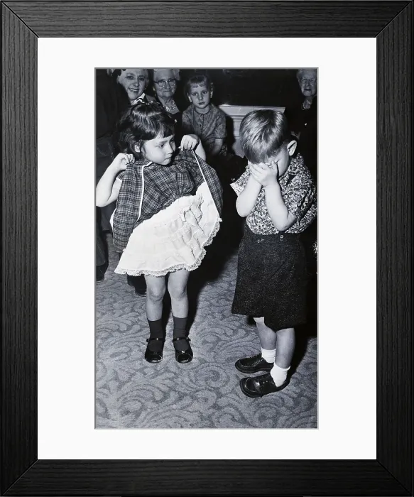 Framed Print : Boy Covering Eyes as Girl Raises Skirt Framed Print : Boy Covering Eyes as Girl Raises Skirt