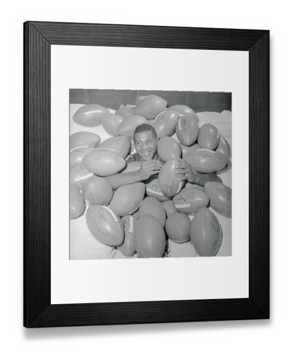 Framed Print : Ernie Davis Buried Beneath Footballs Framed Print : Ernie Davis Buried Beneath Footballs