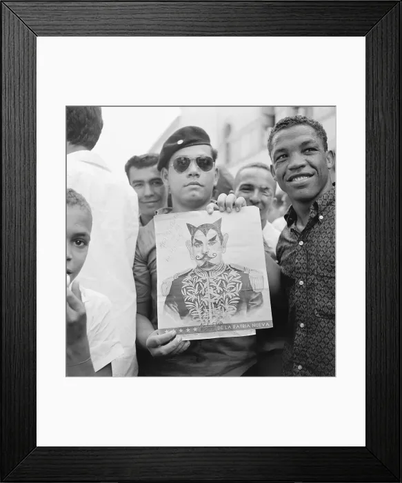 Framed Print : Man Holding Portrait of Trujillo