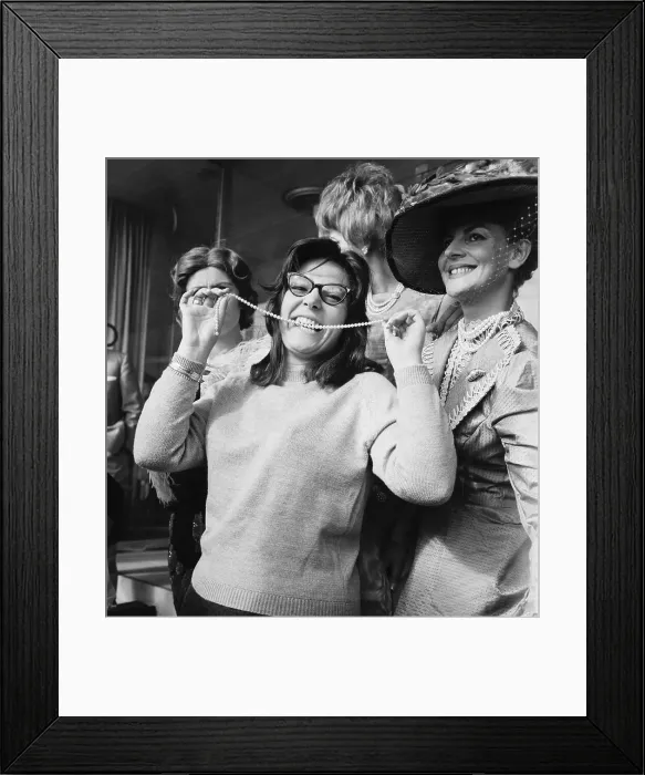 Framed Print : Nana Mouskouri Biting a String of Pearls Framed Print : Nana Mouskouri Biting a String of Pearls