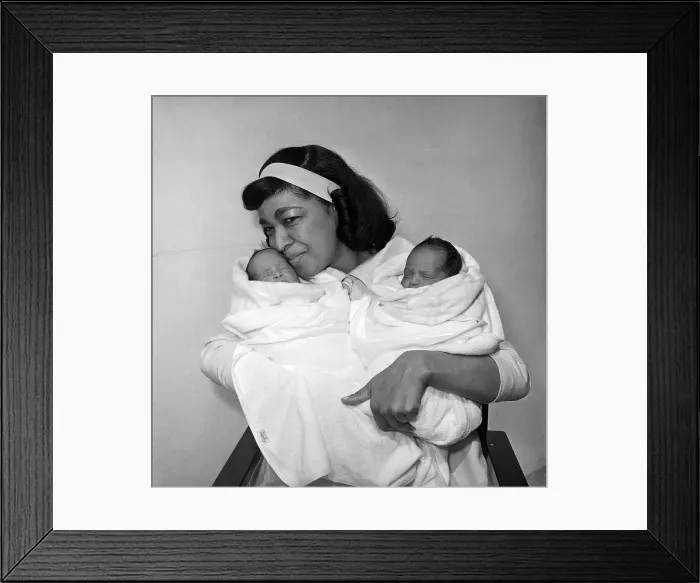 Framed Print : Maria Cole Holding Babies Framed Print : Maria Cole Holding Babies