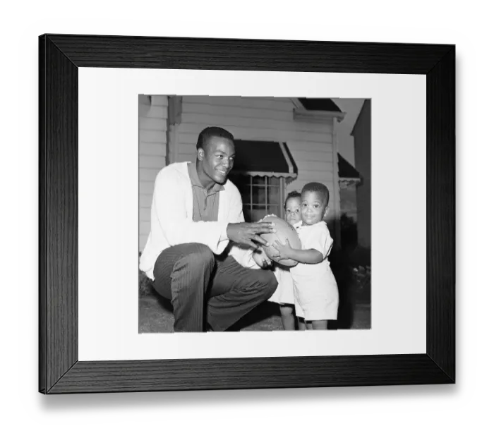 Framed Print : Jim Brown With Twin Children And Football Framed Print : Jim Brown With Twin Children And Football