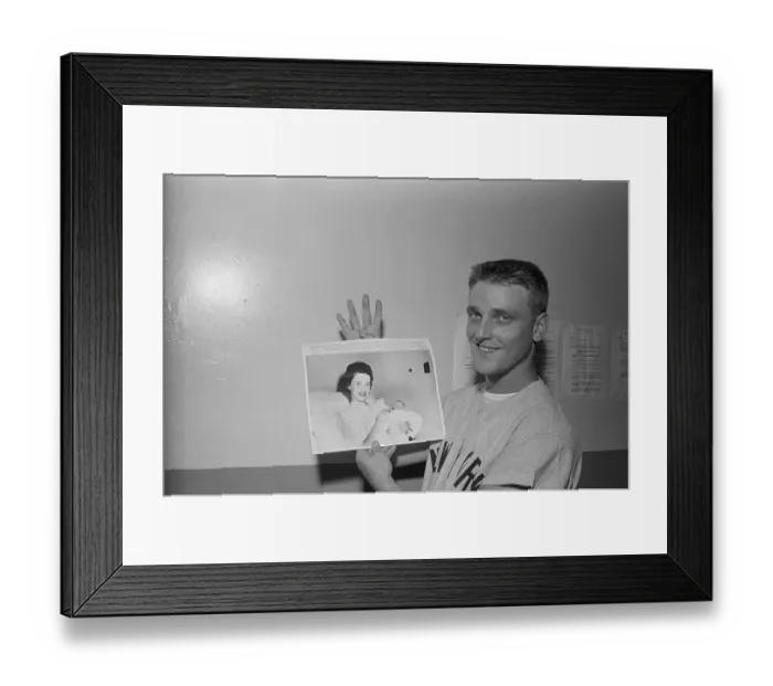 Framed Print : Roger Maris Holding Photo of Child Framed Print : Roger Maris Holding Photo of Child