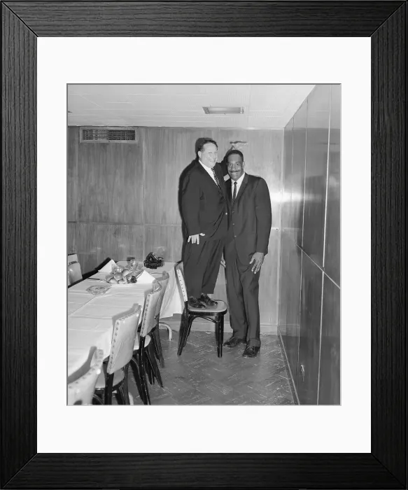 Framed Print : Abe Saperstein Posing on Chair Next to Basketball Player Nat Clifton Framed Print : Abe Saperstein Posing on Chair Next to Basketball Player Nat Clifton