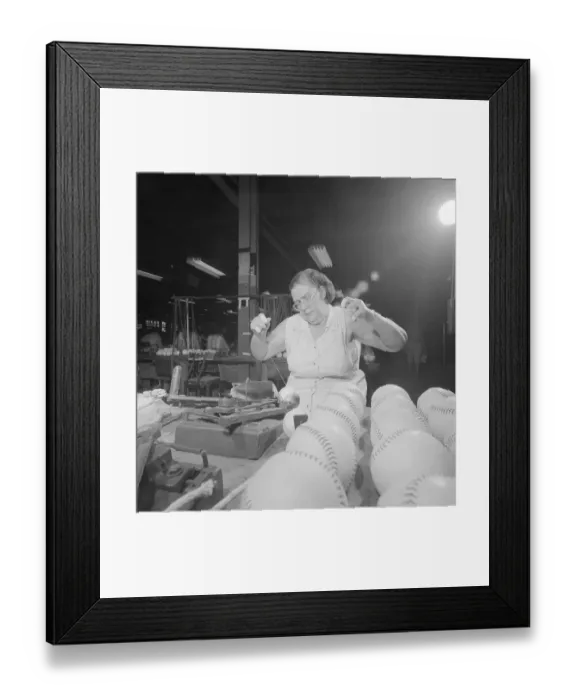 Framed Print : Worker Sewing Covers on Baseballs