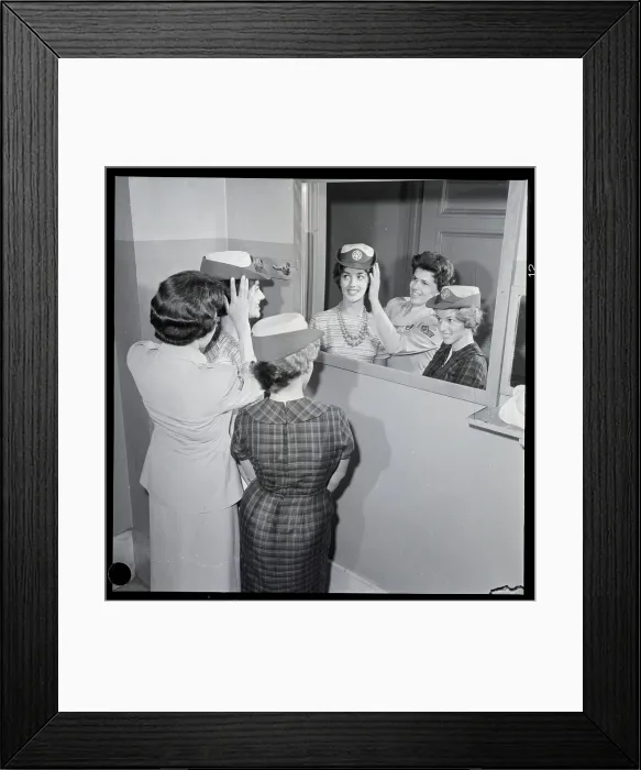 Framed Print : Women Try On Military Hats In Mirror Framed Print : Women Try On Military Hats In Mirror