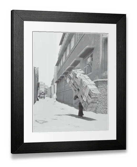 Framed Print : Kuwaiti Man Carrying Crates Framed Print : Kuwaiti Man Carrying Crates