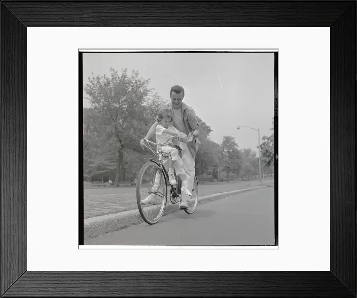 Framed Print : Robert Goulet Riding Bicycle with Daughter Nicki Framed Print : Robert Goulet Riding Bicycle with Daughter Nicki