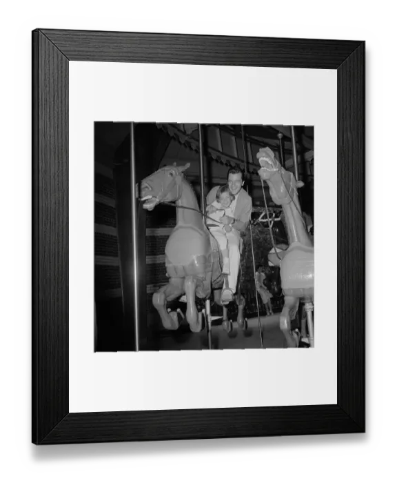 Framed Print : Robert Goulet on Carousel with Daughter Nicki