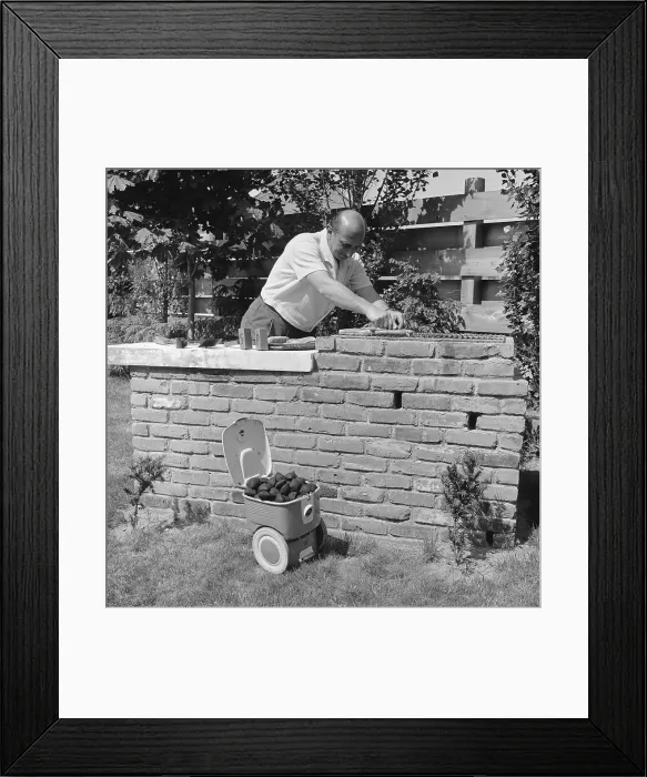 Framed Print : Man Cooking on Backyard Barbecue Framed Print : Man Cooking on Backyard Barbecue