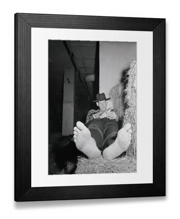 Framed Print : Eddie Carmel Reading a Newspaper