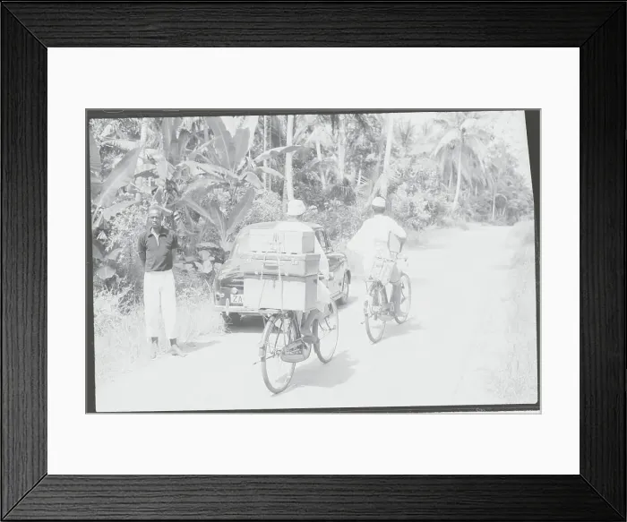Framed Print : Lone Traveler with Car and Refugee Bicyclists Passing on Highway Framed Print : Lone Traveler with Car and Refugee Bicyclists Passing on Highway