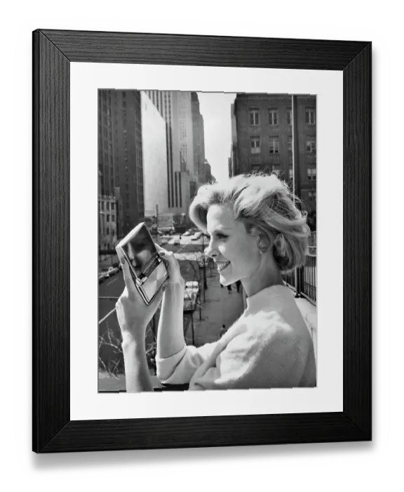 Framed Print : Woman Holds Compact Sized Television Framed Print : Woman Holds Compact Sized Television