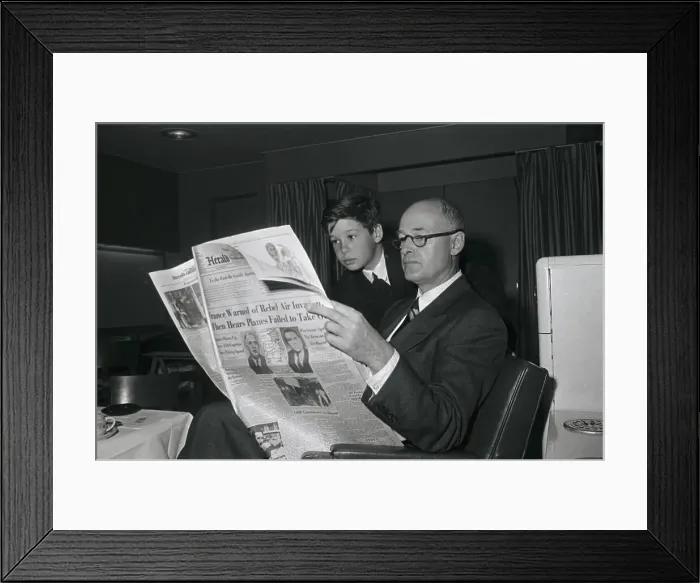 Framed Print : Son Reading Newspaper over George Kennan's Shoulder Framed Print : Son Reading Newspaper over George Kennan's Shoulder