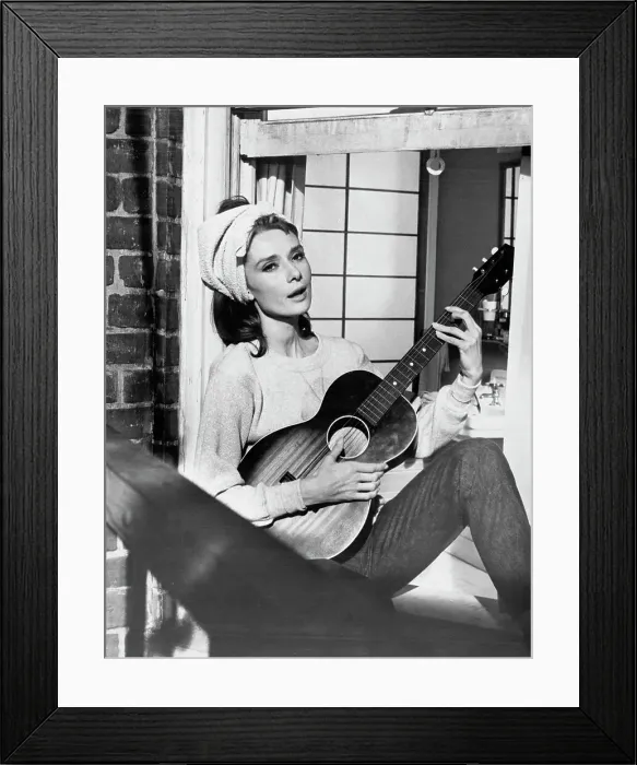 Framed Print : Audrey Hepburn Playing Guitar in Breakfast at Tiffany's Framed Print : Audrey Hepburn Playing Guitar in Breakfast at Tiffany's