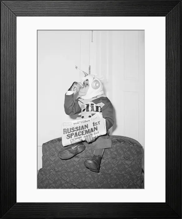 Framed Print : Dressed Chimpanzee Holds Nose &Newspaper Framed Print : Dressed Chimpanzee Holds Nose &Newspaper