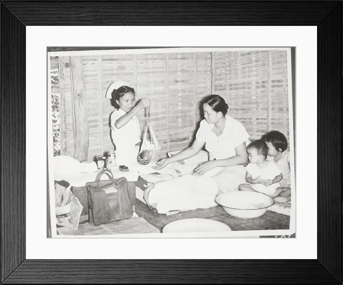 Framed Print : woman Weighing Infant Framed Print : woman Weighing Infant