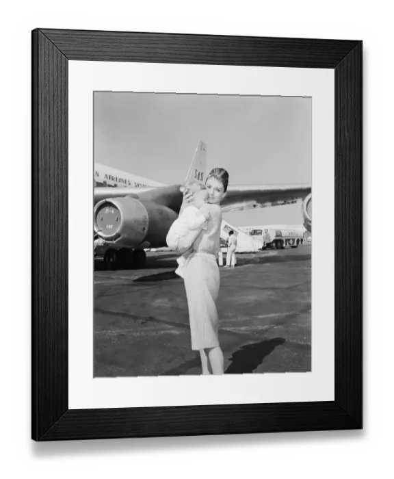 Framed Print : Audrey Hepburn Holding Baby Son Sean Near Airplane Framed Print : Audrey Hepburn Holding Baby Son Sean Near Airplane