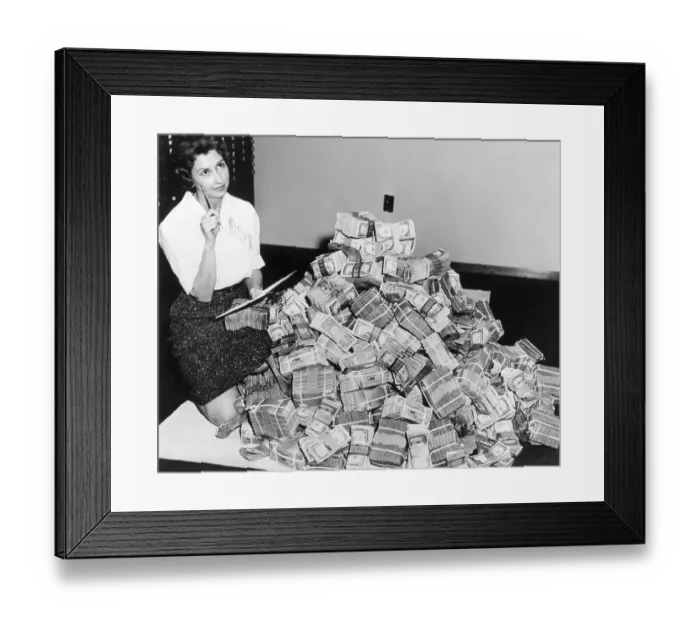 Framed Print : Bank Employee Sitting by a Million Dollars in Cash Framed Print : Bank Employee Sitting by a Million Dollars in Cash