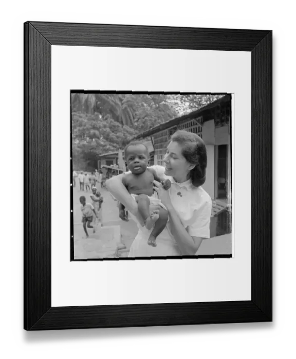 Framed Print : Woman as Foreign Caretaker Holding Child Framed Print : Woman as Foreign Caretaker Holding Child