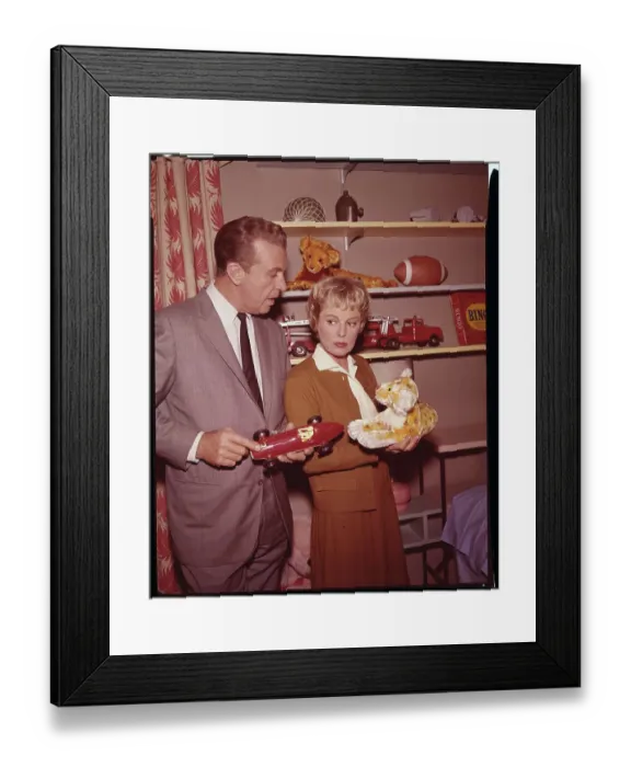 Framed Print : Dick Powell and June Allyson Holding Children's Toys Framed Print : Dick Powell and June Allyson Holding Children's Toys