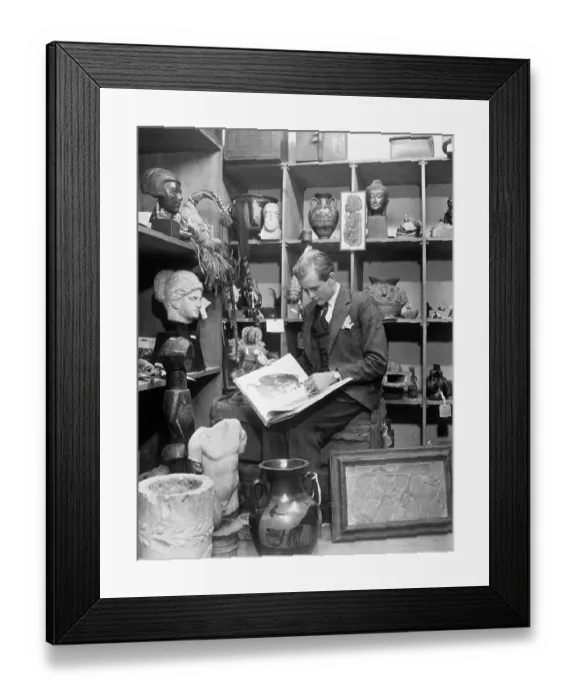 Framed Print : Young Man Looknig at Antiques