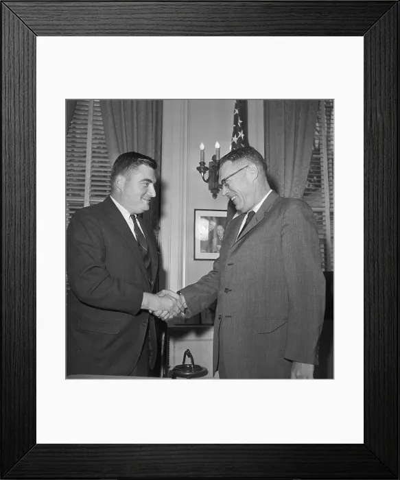 Framed Print : James Hagerty Shaking Hands with Pierre Salinger