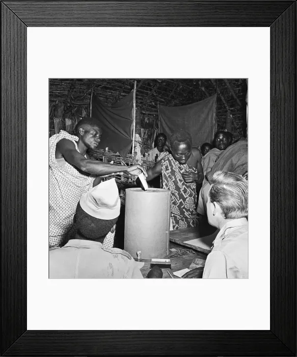 Framed Print : 2 Men (Trad. Dress) Cast Ballots In Box Framed Print : 2 Men (Trad. Dress) Cast Ballots In Box