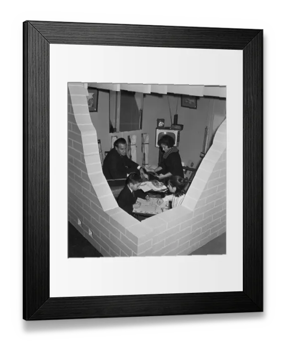 Framed Print : Family Sitting in Model Fallout Shelter Framed Print : Family Sitting in Model Fallout Shelter