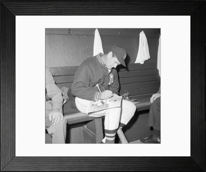Framed Print : Ted Williams Sitting in Dugout and Signing for Fans Framed Print : Ted Williams Sitting in Dugout and Signing for Fans