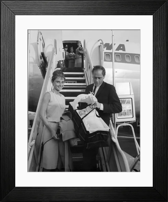 Framed Print : Audrey Hepburn and Mel Ferrer Walking From Airplane With Their Baby Framed Print : Audrey Hepburn and Mel Ferrer Walking From Airplane With Their Baby