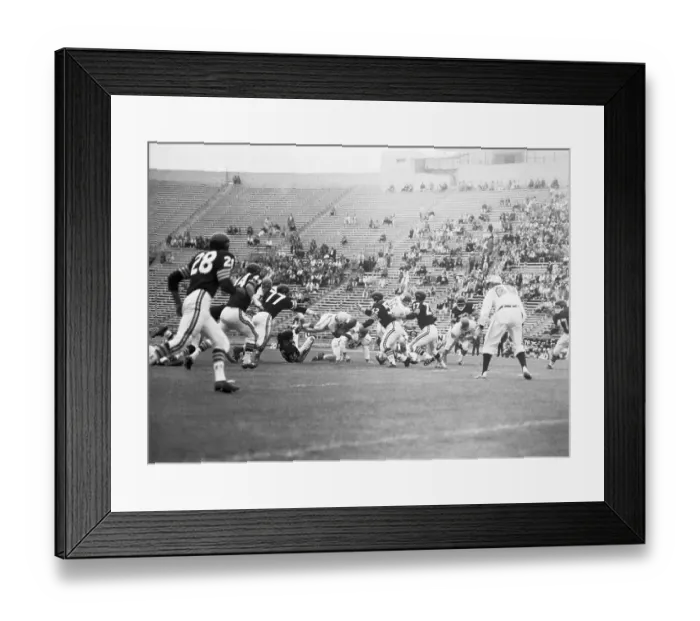 Framed Print : Johnny Robinson Diving Through Air with Football Framed Print : Johnny Robinson Diving Through Air with Football